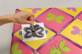 Stencil graphite outlines on all the butterflies.