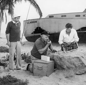 Gilligan, the Skipper and the Professor attempt to use a CB radio in front of their shipwrecked SS Minnow on 'Gilligan's Island.' See more beach pictures.
