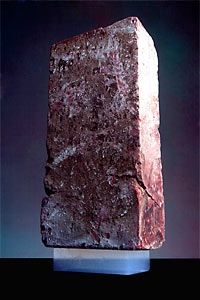 A 5.5 pound brick is supported by a piece of silica aerogel weighing only 2 grams (0.07 ounces).
