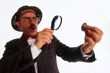 archaeologist examining evidence with a magnifying glass