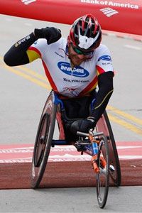 Two-time defending champion Kurt Fearnley, of Australia, crosses the finish line of the Chicago Marathon with a time of 1:29:09 on Sunday, Oct. 11, 2009.