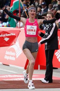 Liliya Shobukhova, of Russia, celebrates as she crosses the finish line to win the women's 2009 Chicago Marathon.