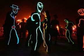 Suenos Del Agave performers dance while wearing EL wire costumes during the 2008 Burning Man project.