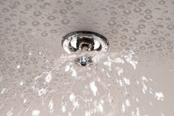 Showering water cascades from faucet.