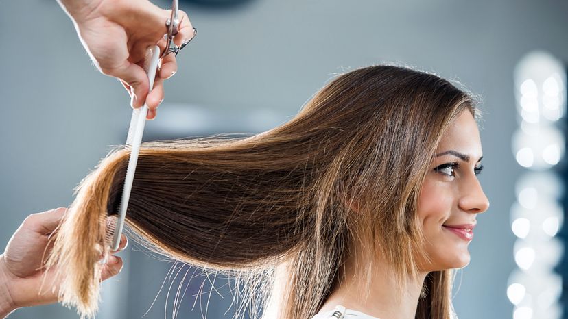 A woman getting her hair done at the hairdressers. 