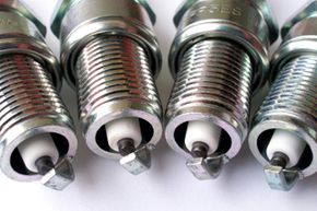 Newer spark plugs can often last up to 100,000 miles -- but it may not be a good idea to leave them in there quite so long.