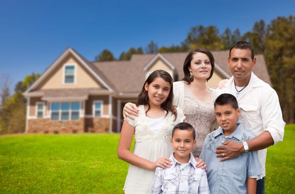 family in front of house