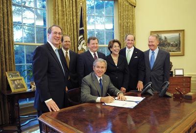 U.S. President George W. Bush signs the Internet Tax Freedom Act Amendments Act of 2007 in the Oval Office of the White House in Washington, D.C.