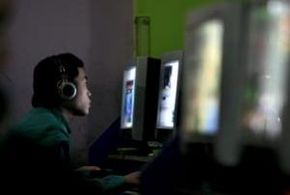 A Chinese youth plays an online game in Chongqing Municipality, China. Could the Internet International Ad Hoc Committee have changed the way he surfs the Web?