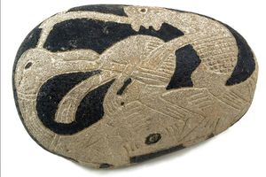 Ica Stone with image of man and dinosaur