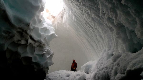 person in ice cave in Mount Erebus in Antarctica