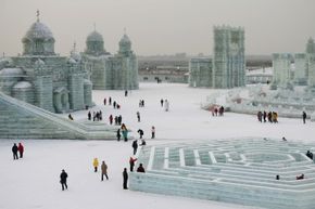 The Harbin International Ice and Snow Festival by day may not have all of the evening light effects to illuminate the ice, but it’s still dazzling.