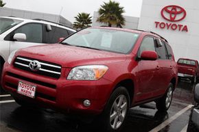 A brand new Toyota RAV4 is displayed on the Toyota of Marin sales lot in San Rafael, Calif.