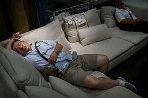 man sleeping at ikea