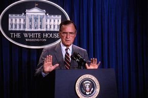 President George H.W. Bush speaks at a press conference in 1990. Conspiracy theorists thought his 'new world order' speech foretold a one-world government.