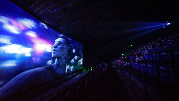 People watch IMAX 3D film Avatar in theater