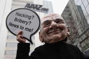 A protestor dressed as Rupert Murdoch during a February 2012 protest in London, England. 