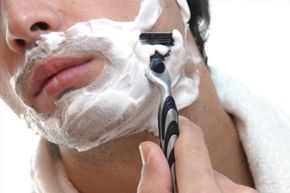 close up of man shaving