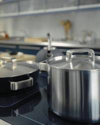 Stainless steel pots on an induction stovetop
