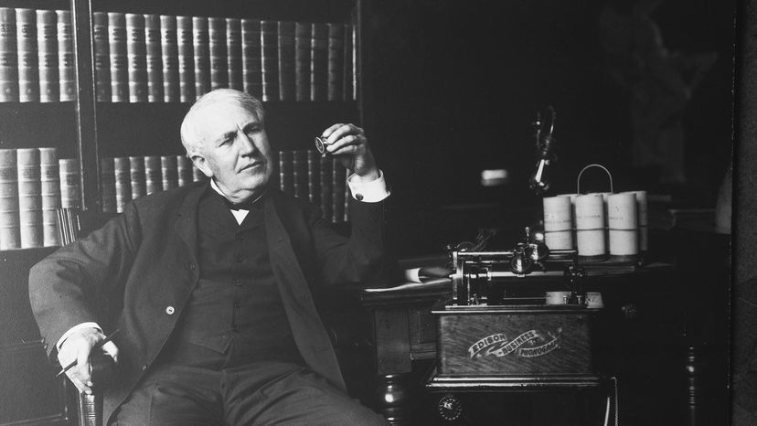 Thomas Alva Edison poses with the Edison Business Phonograph