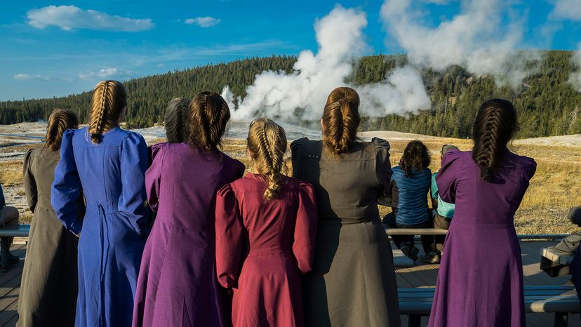 Female members of the Fundamentalist Church of Jesus Christ of Latter-Day Saints visit Old Faithful.