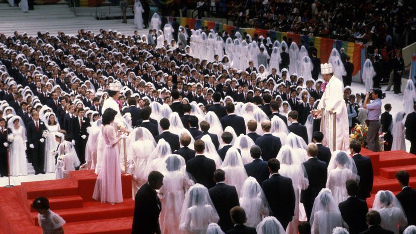 Rev. Sun Myung Moon performs one of his signature mass marriages for Unification Church members.