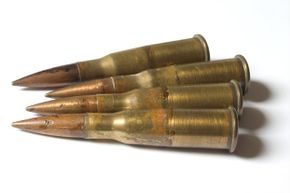 The rims at the bottom of these four old bullets are easy to make out. You won't see that rim on the more modern center-fire cartridge featured next.