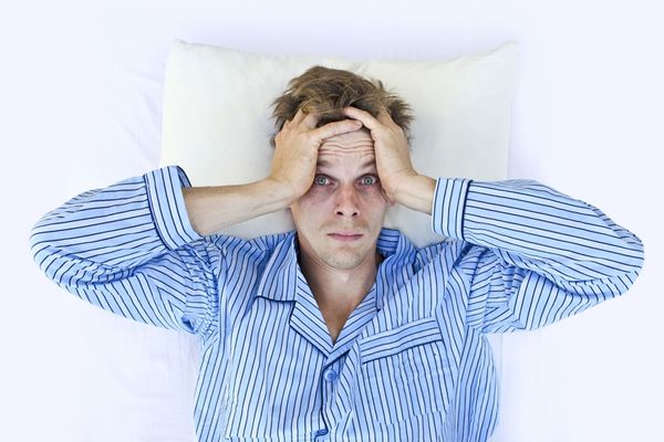 Man with insomnia looking fretful