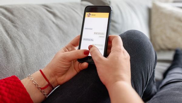 Woman using instant messaging app on her smartphone