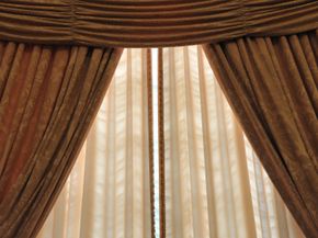 Insulated curtains can help lower your heating and cooling costs.­ See more pictures of green living.