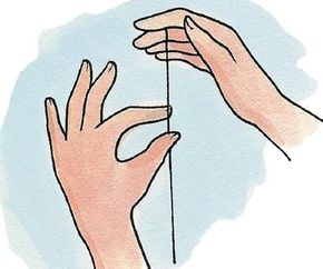 Grab the yo-yo string with your free hand.