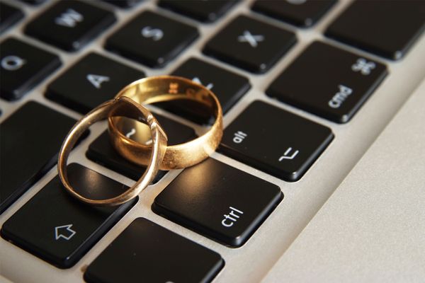 Wedding rings on computer keyboard