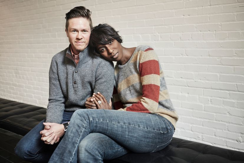 young couple sitting on ground