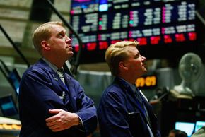 Traders watch Treasury Secretary Timothy Geithner detail his financial recovery plan on the floor of the New York Stock Exchange in February 2009. 