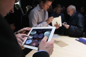 Man playing with Apple iPad 2