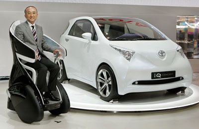 President of Japan's auto giant Toyota Motor Katsuaki Watanabe introduces the ultra-high fuel efficient and ultra-low emission iQ Car.