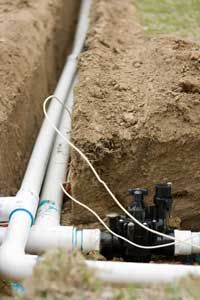 Subsurface irrigation lines will make this lawn sprinkler system possible without cluttering the yard with pipes.