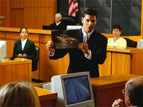 A lawyer presents evidence to a jury.