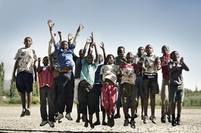 Group of young children jumping in unison