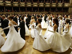 Debutantes glide across the floor at the Vienna Opera Ball in February 2004. Junior League began with a debutante's hopeful vision for a better society.