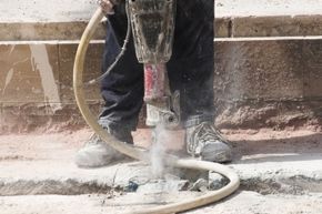 Jackhammers can kick up a lot of fine particulate, so wearing a face mask and wetting the work area are good ideas.