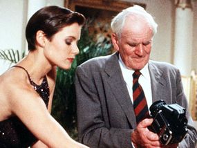 Carey Lowell as Bond Girl Pam Bouvier and Desmond Llewelyn as the original "Q" in the 1989 film "License to Kill"”border=