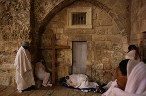 Ethiopian Christian pilgrims sleep outside the Church of the Holy Sepulcher in Jerusalem