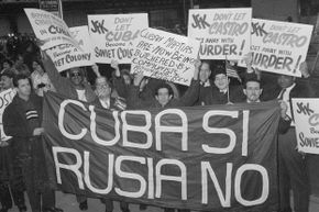 Anti-Castro demonstrators hold up signs near the Waldorf-Astoria hotel, in New York City in 1961. This was to coincide with Kennedy's arrival there for a speech. Like their arch-foe, anti-Castro forces were considered possible conspirators.