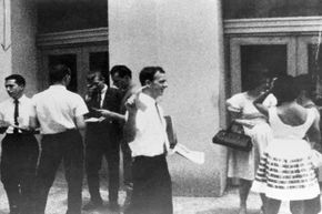 Lee Harvey Oswald is seen distributing pro-Cuba flyers on the streets of New Orleans, La. in 1962.