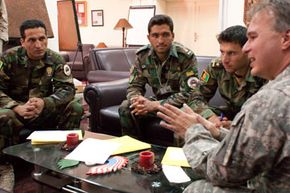 Bill Doan, a project manager with the U.S. Army Corps of Engineers, speaks to a group of soldiers who are interning with the organization for six months.