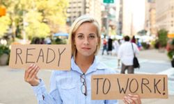 Woman holding up "ready to work" signs