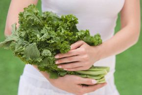 Woman holding kale