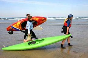 Kayak surfers watching the waves