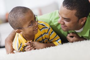 Dad and son talking